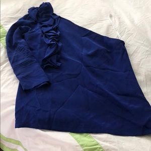Karina Grimaldi deep blue asymmetrical blouse.